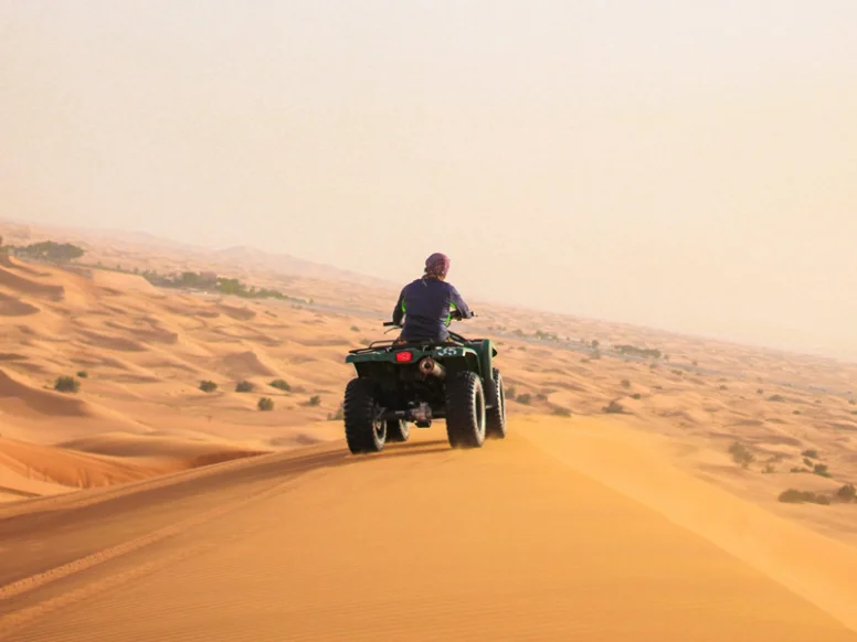 Jeep crossing a high sand dune